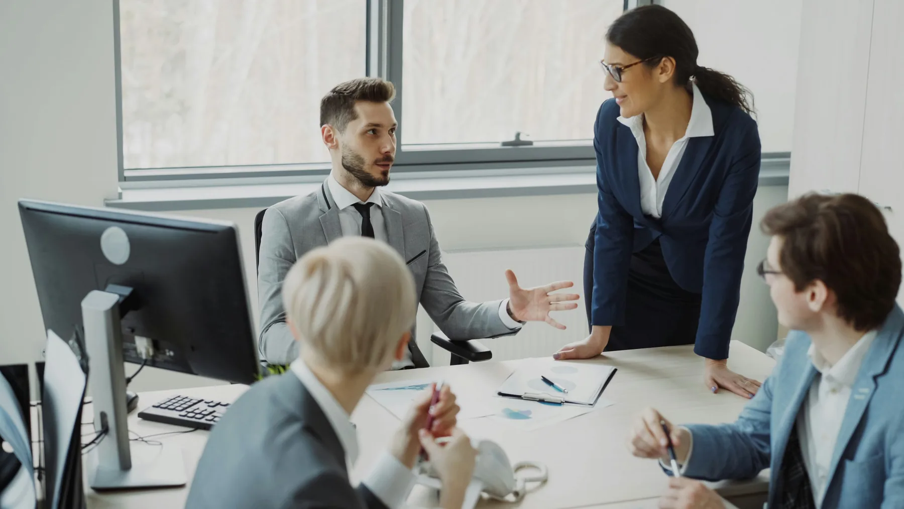 Executives discussing a global business map in an office