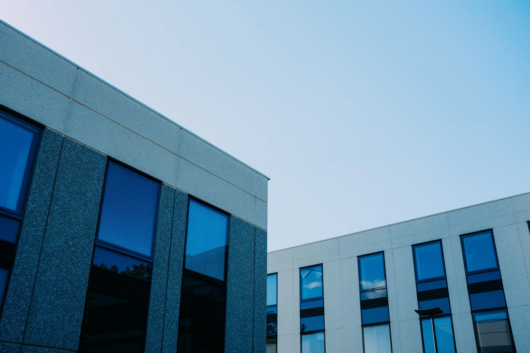 Contemporary commercial buildings with broad glass windows