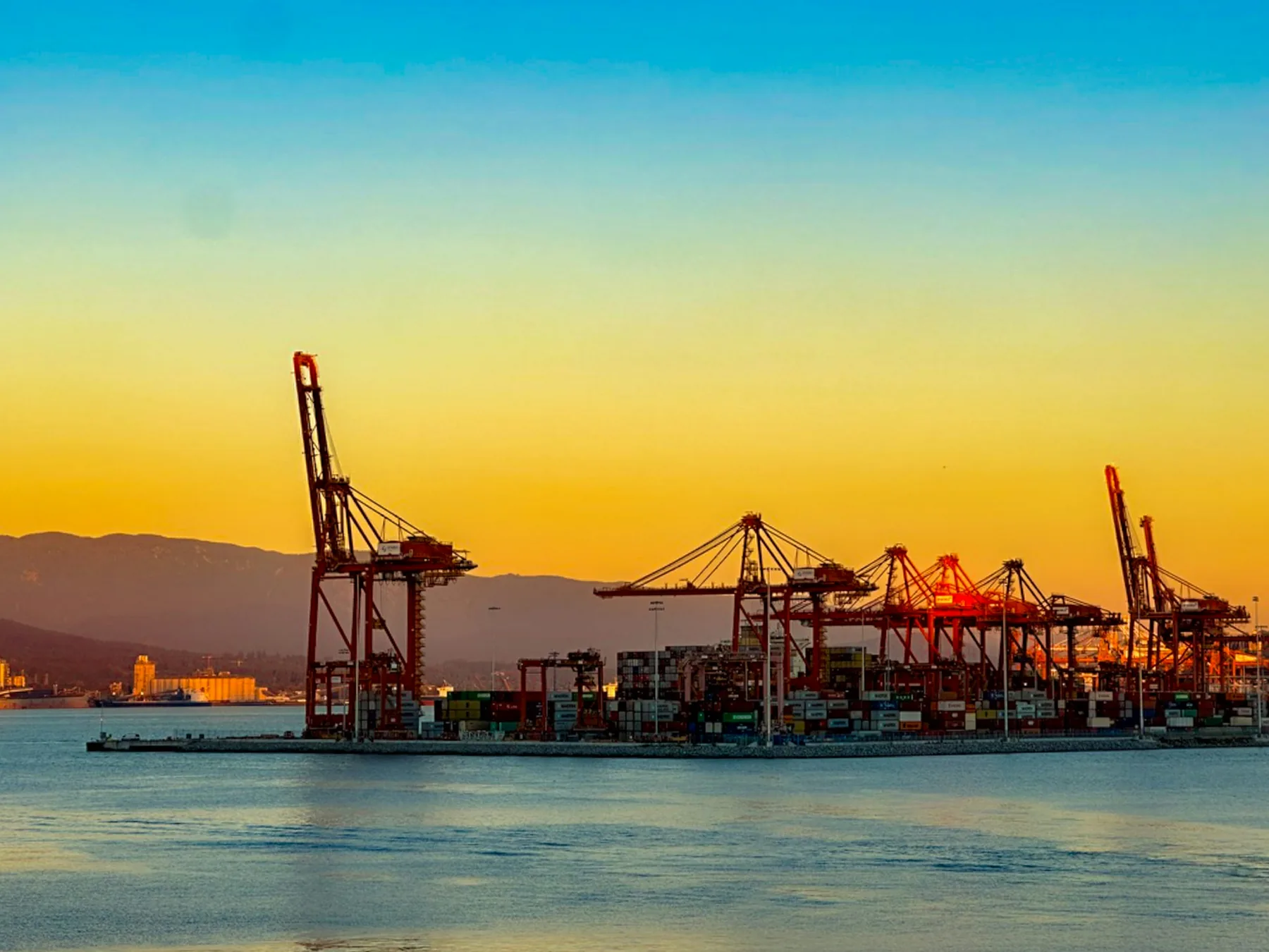 International port and urban logistics district at golden hour