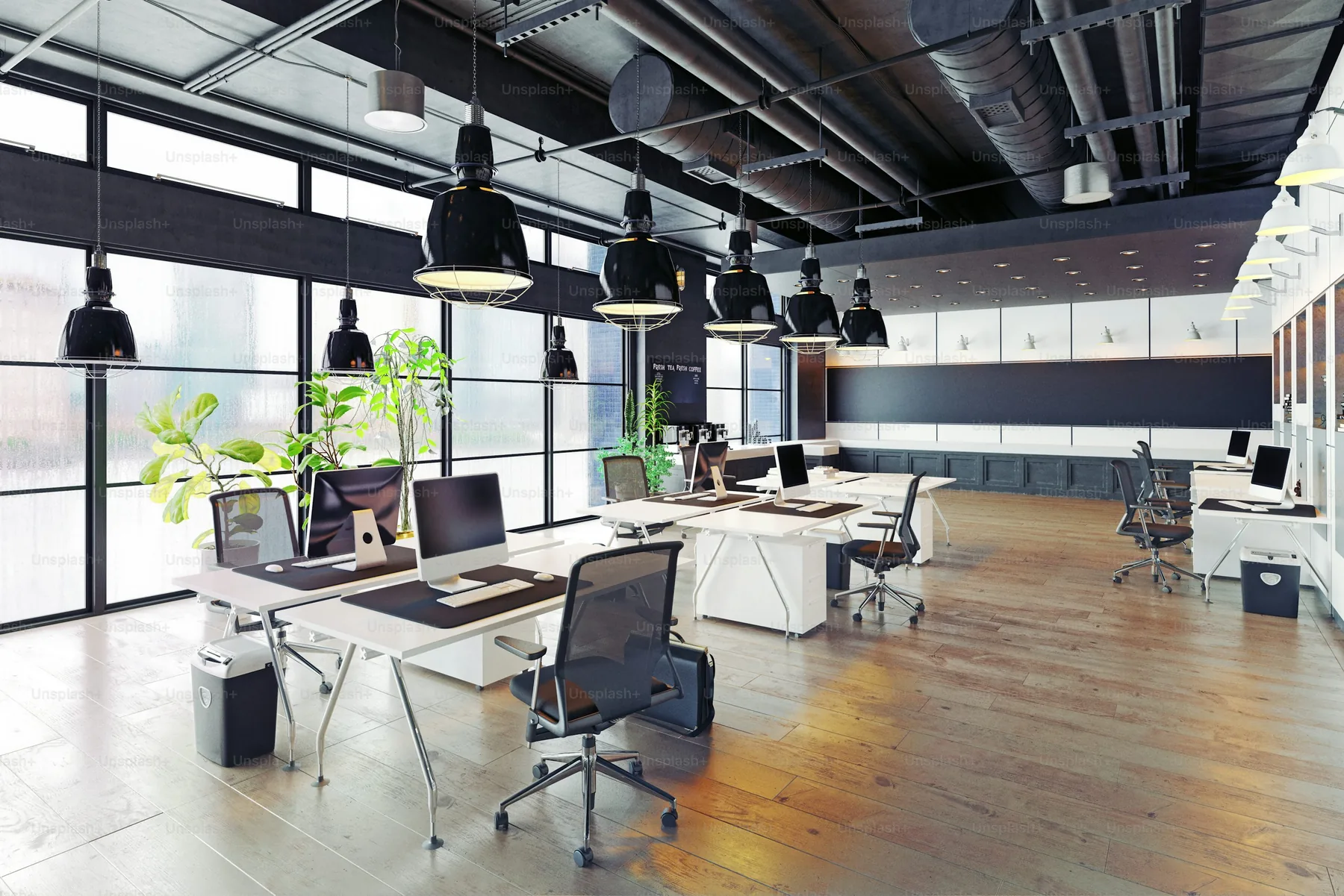 Architectural model and planning documents in a modern office